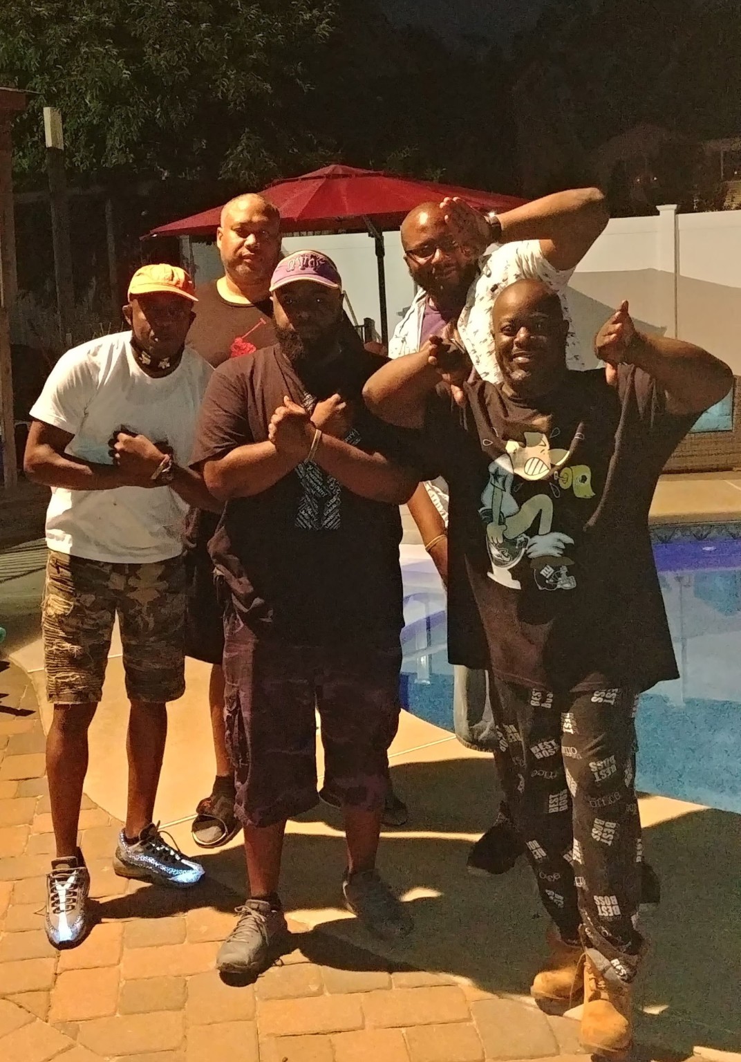 Fall 2009 line members posing beside a pool at night