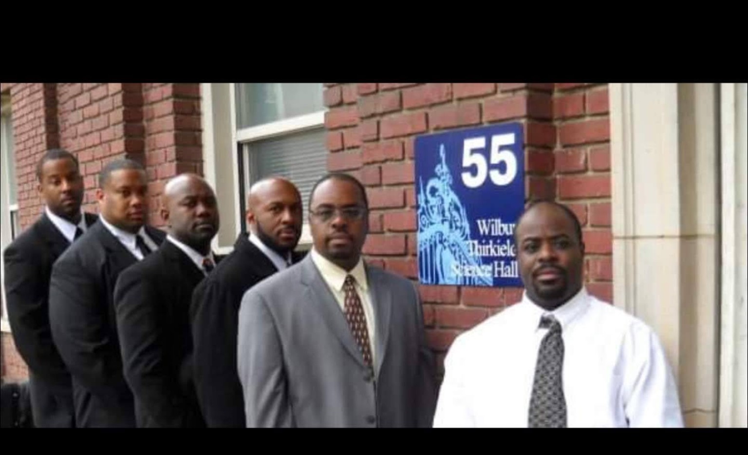 Fall 2009 line members standing outside a campus building